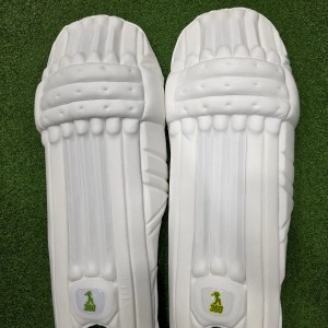 Top view of EM 360 Bull Ring adult white cricket batting pads on artificial grass on Alberta.