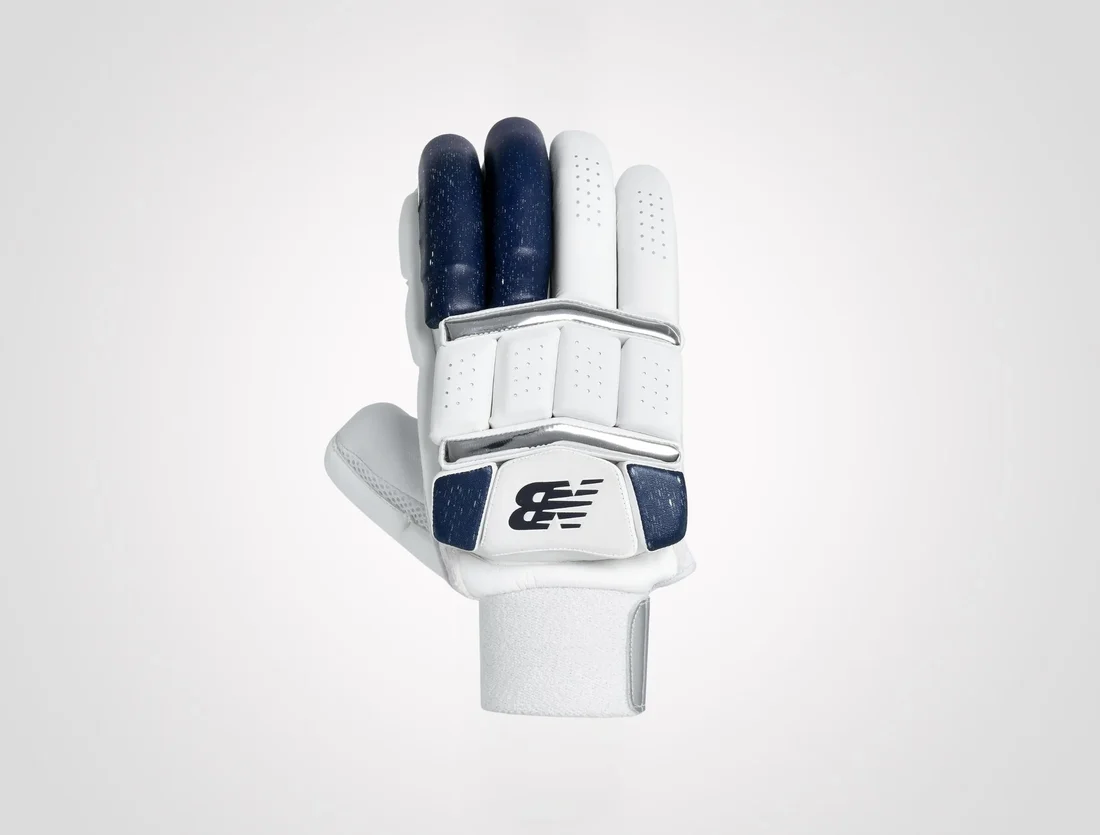 New Balance DC 10i Pro adult cricket batting gloves in white and navy blue with protective finger rolls on albertacrickets.com.